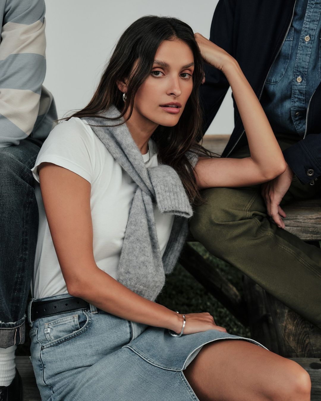 Denim skirt from AG Jeans paired with a white tee and grey sweater. 