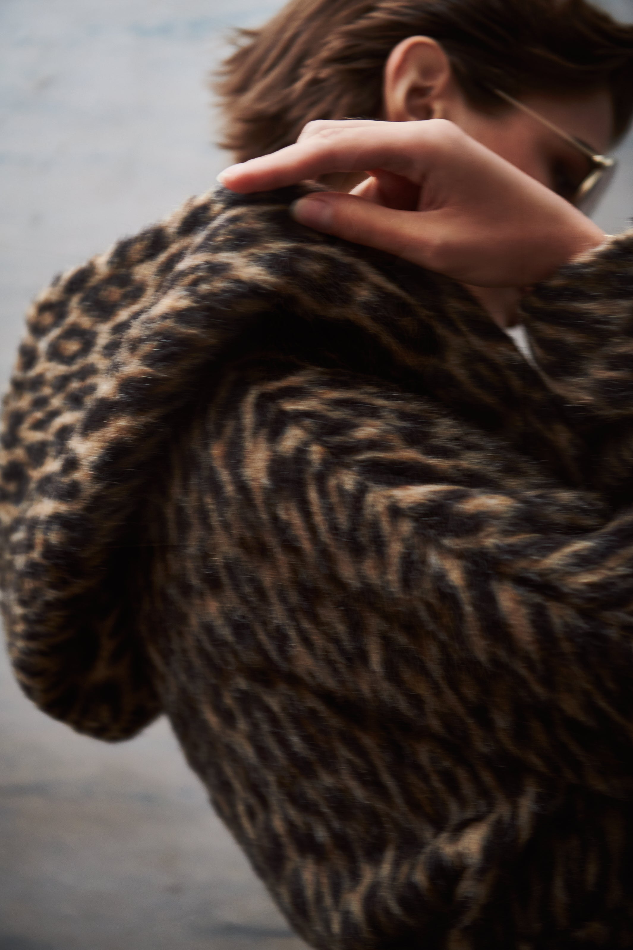 The Daisy Leopard Print Hooded Coat by Tagliatore accessorized with the Mabuhay Matte Gold Reading Glasses